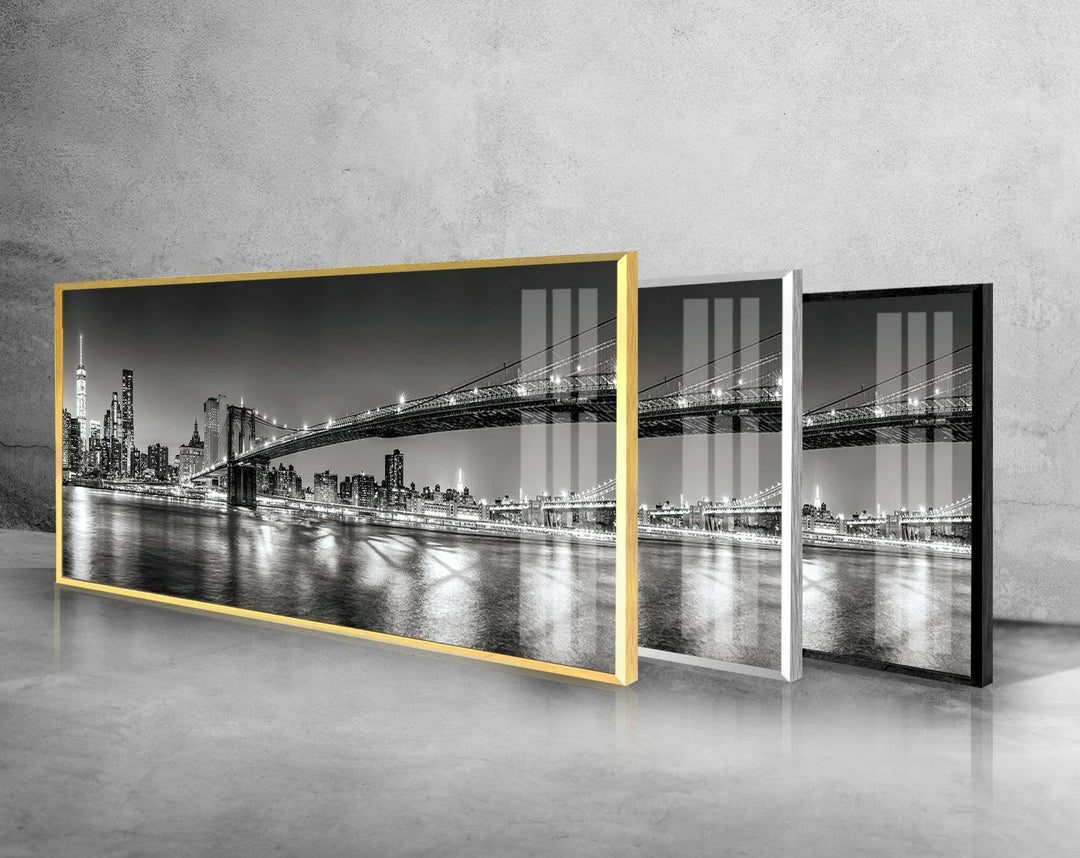 Stylish glass wall art capturing the Brooklyn Bridge stretching over the reflective waterfront.