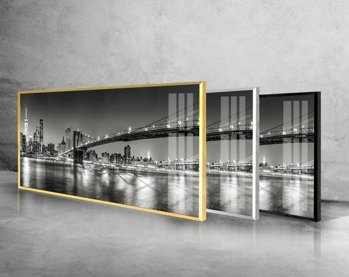 Stylish glass wall art capturing the Brooklyn Bridge stretching over the reflective waterfront.